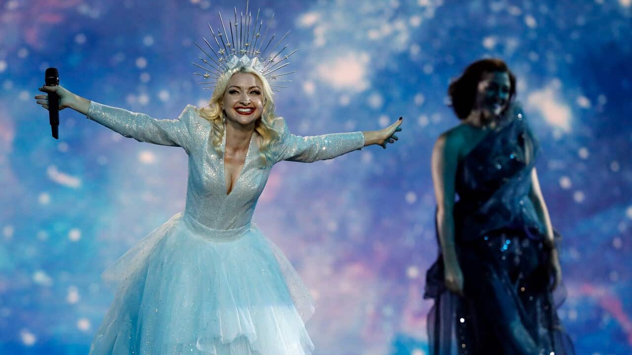 Kate Miller-Heidke of Australia, left, performs the song "Zero Gravity" during the 2019 Eurovision Song Contest grand final in Tel Aviv, Israel, Saturday, May 18, 2019. (AP Photo/Sebastian Scheiner)