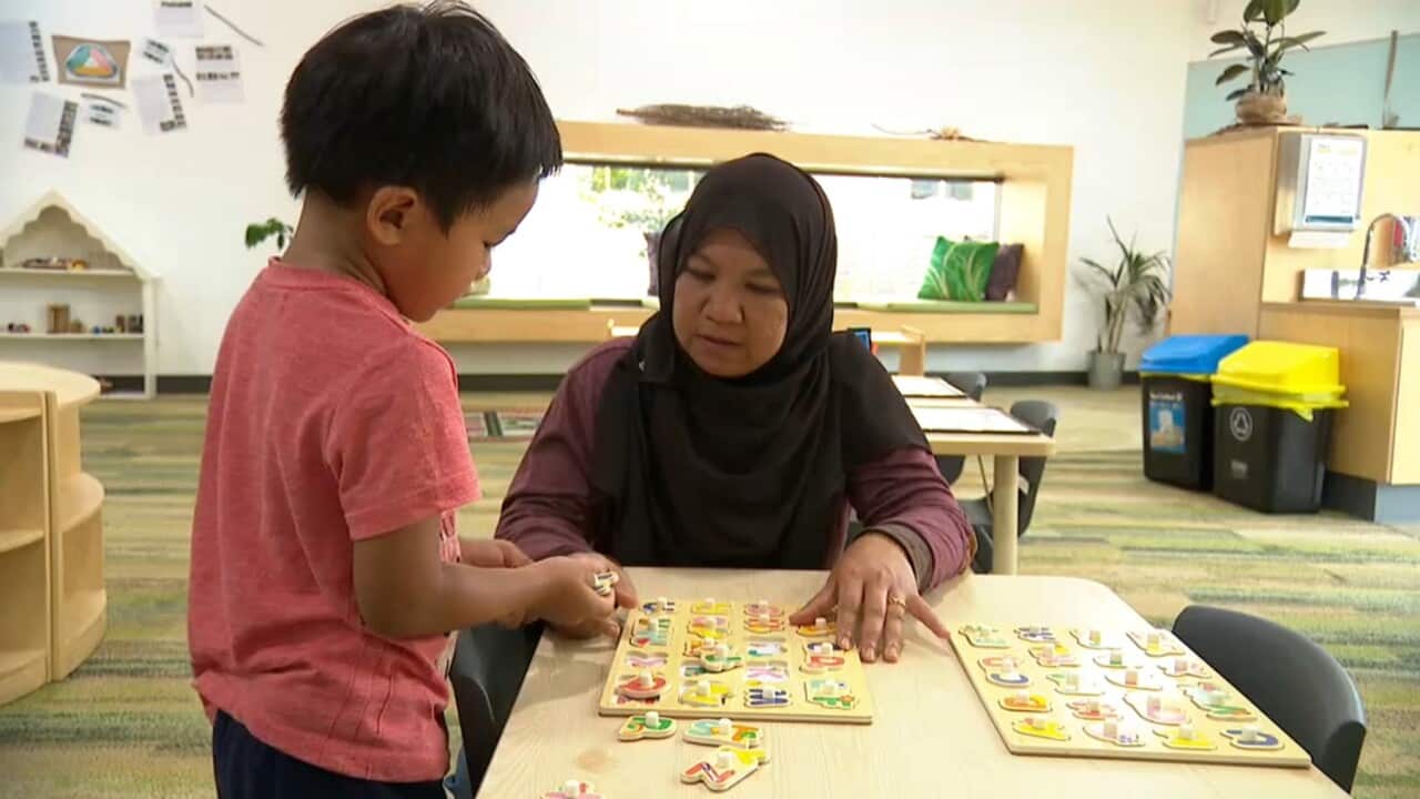 Salbiah (R) and Haqqi at daycare