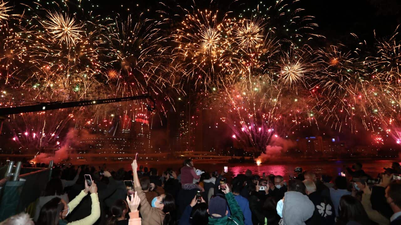 People celebrate in Brisbane after the International Olympic Committee voted to confirm the city will host the 2032 Summer Olympics, on 21 July, 2021.