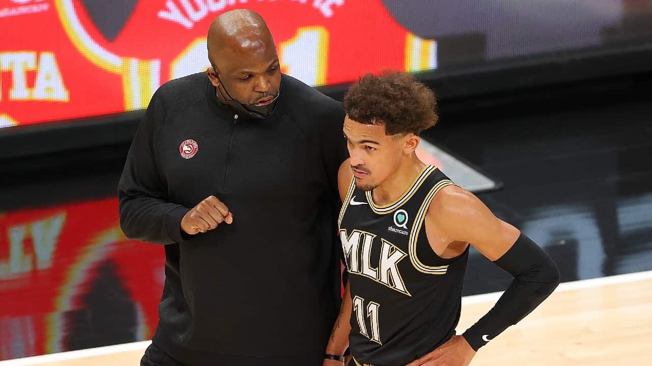 Atlanta Hawks head coach Nate McMillan and guard Trae Young