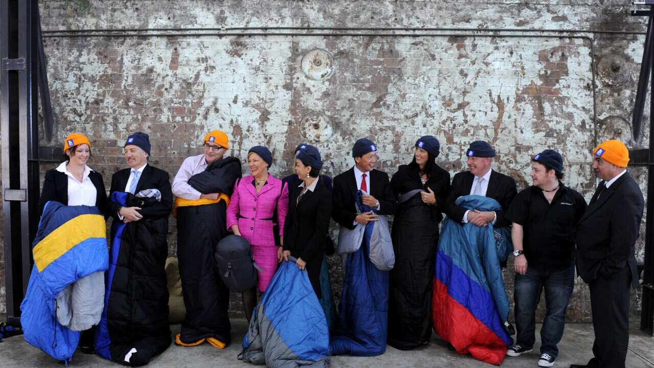 CEOs pose for a photograph for the St Vincent de Paul Society annual CEO Sleepout in Sydney, Tuesday, May 1, 2012. (AAP)