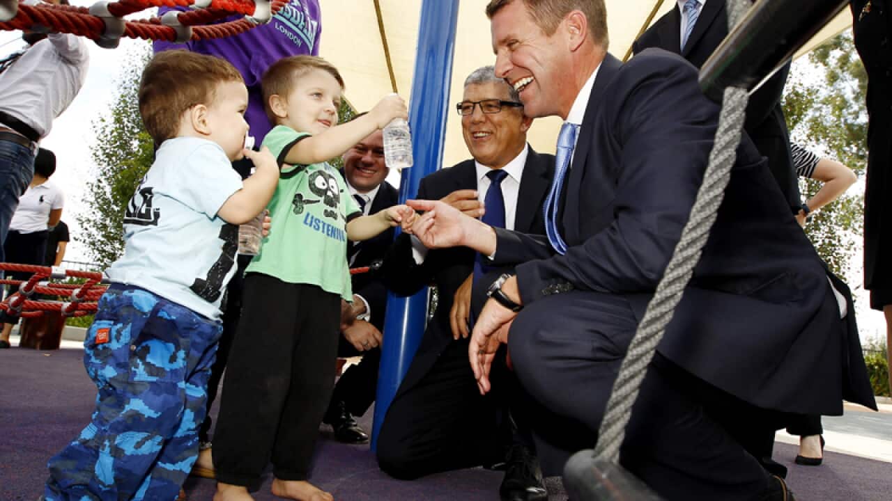 NSW Premier Mike Baird with children with disabilities