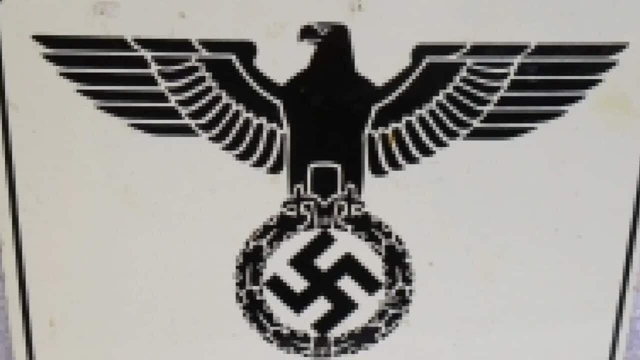 Auction items include Third Reich items such as a portrait of Hitler and a dagger with the etched motto 'Alles fur Deutschland'.