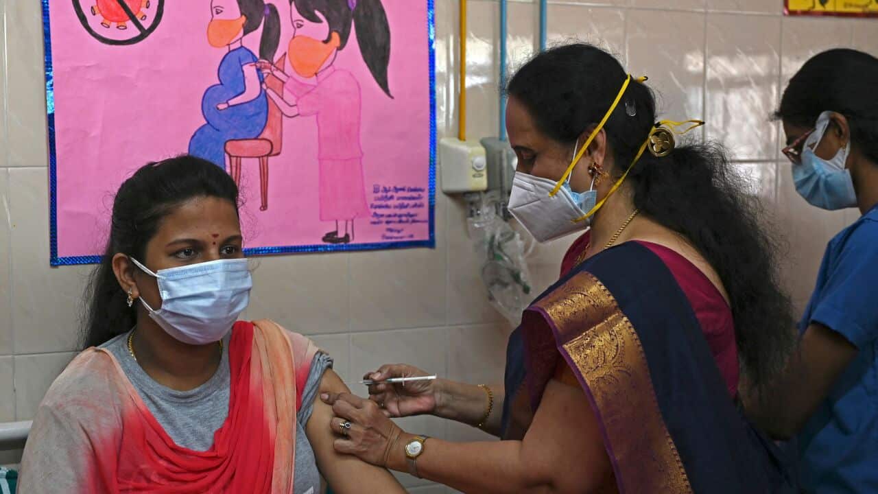 A pregnant woman gets inoculated with a dose of the Covaxine vaccine against the Covid-19 coronavirus at a government maternity and child hospital in Chennai on July 5, 2021. (Photo by Arun SANKAR / AFP) (Photo by ARUN SANKAR/AFP via Getty Images)