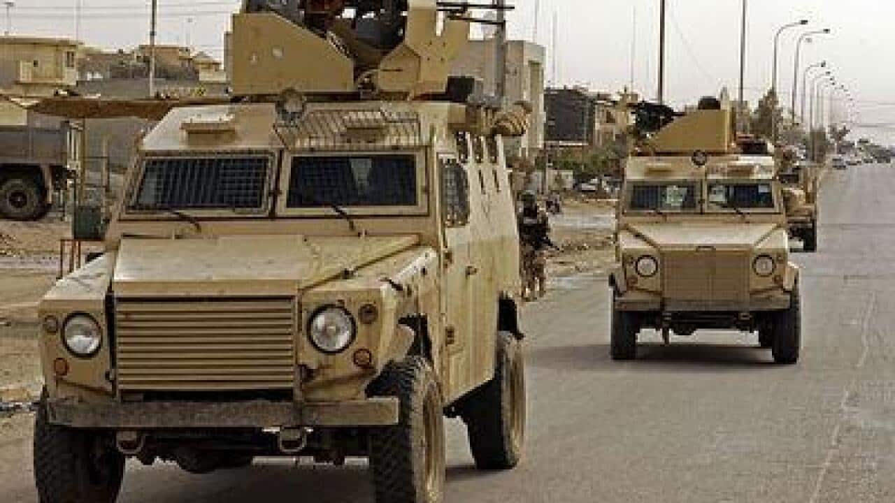 Iraqi soldiers and armoured vehicles at Mosul - Iraq