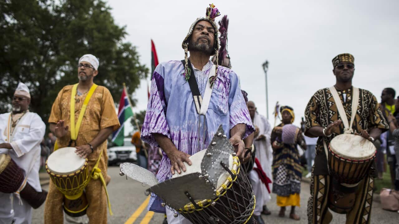 Drummers perform in a drum call and parade of flags during the 2019 African Landing Commemorative Ceremony.
