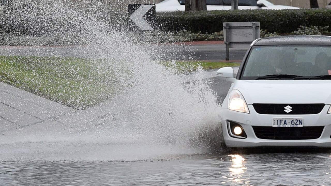 A driver negotiates flash flooding in Melbourne