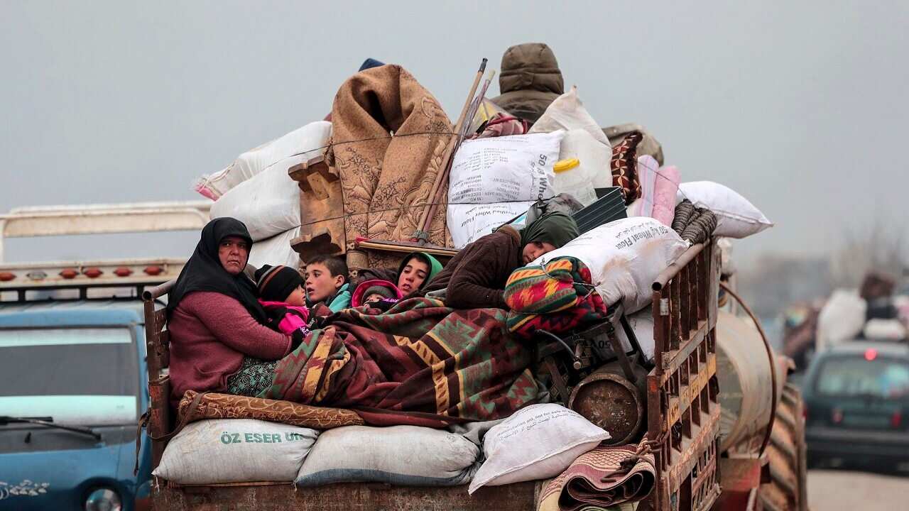 Civilians leave Idlib to find safety near the border with Turkey.
