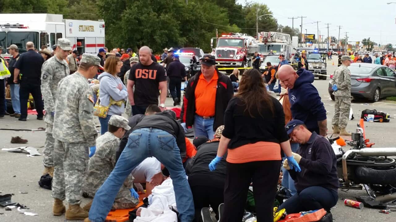 Emergency personnel after a vehicle crashed into a crowd, Oklahoma