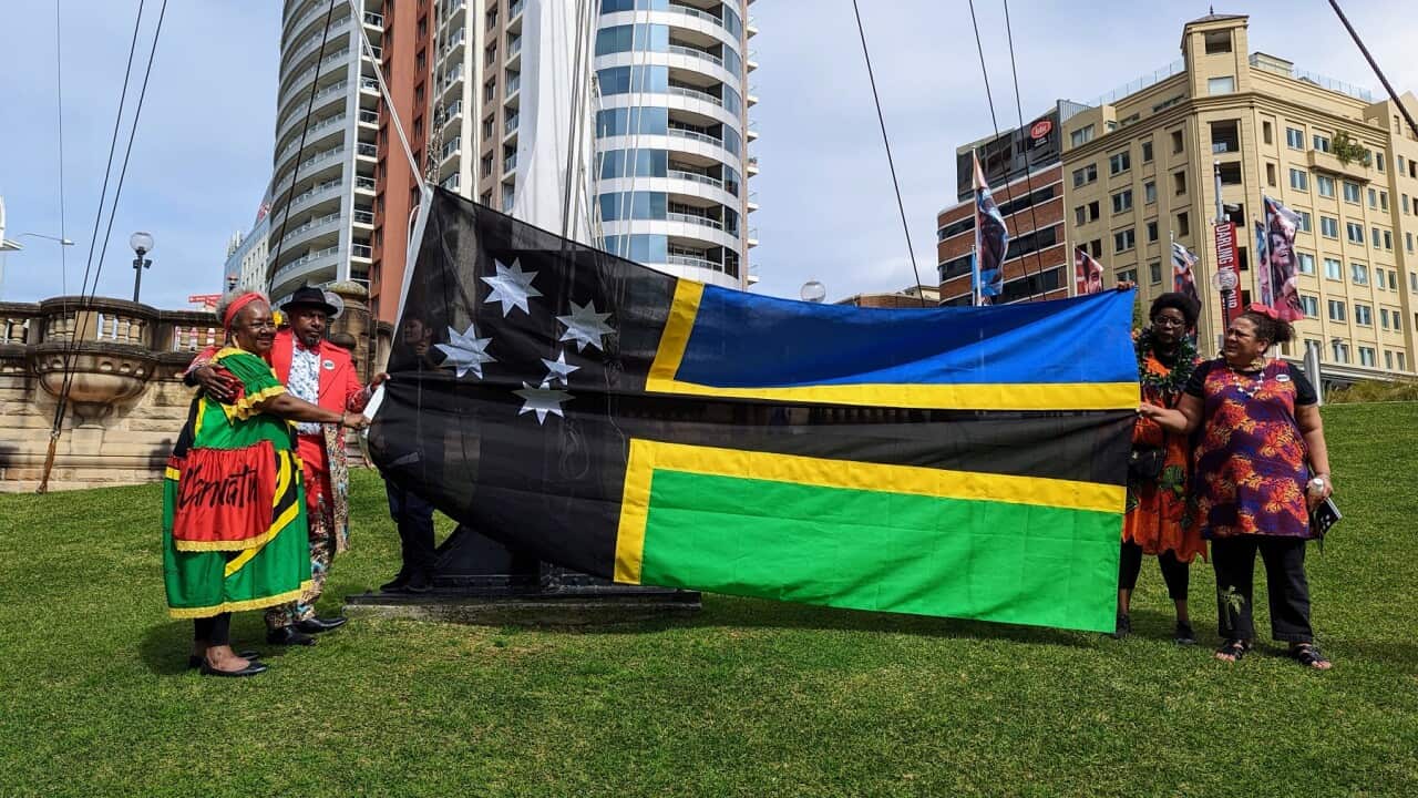 Vilvil Fare and Councillor Emelda Davis flag raising outside the National Maritime Museum (SBS).jpg