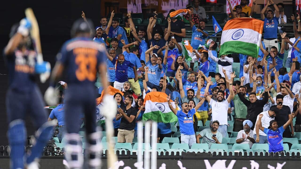 Indian fans celebrate their win over Australia during the second T20 cricket match between Australia and India at the SCG, Sydney, Sunday, December 6, 2020.