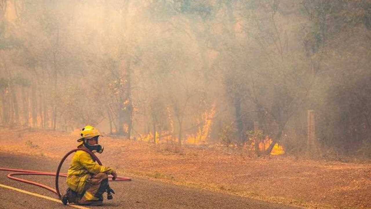 Fire fighter fighting a fire near Deepwater in Queensland