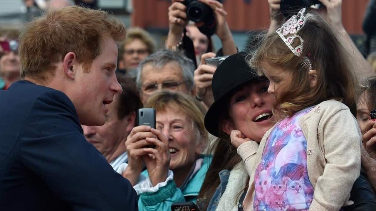 Prince Harry meets the crowd during a walkabout in New Zealand.