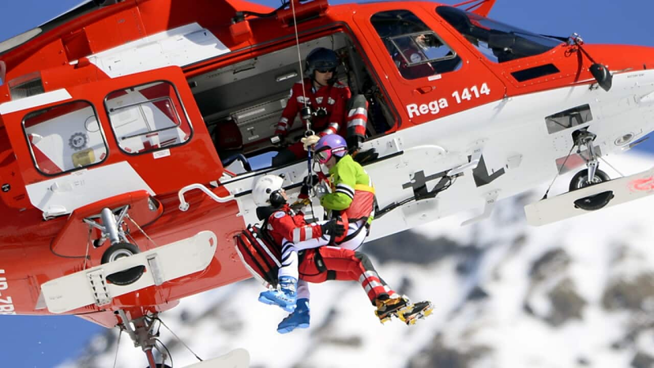 Germany's Maria Hoefl-Riesch is evacuated by helicopter