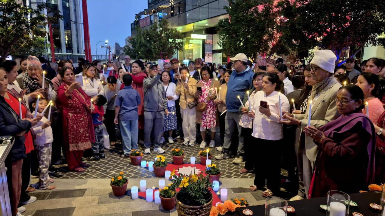 Nepali community members attend a vigil for victims of the devastating floods in Nepal in Hurstville, south Sydney.