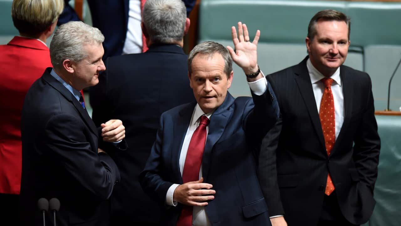 Opposition Leader Bill Shorten waves as he prepares to deliver his 2015 Budget address in response to the 2015/16 federal budget in the House of Representatives at Parliament House in Canberra, Thursday, May 14, 2015. (AAP Image/Lukas Coch) NO ARCHIVING