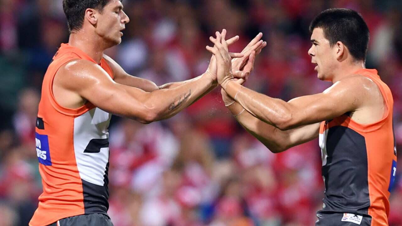 Jonathon Patton (L) of the Giants is congratulated by Matthew Kennedy