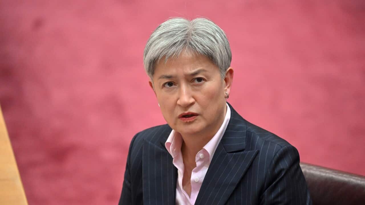 Penny Wong, sitting in a brown chair.