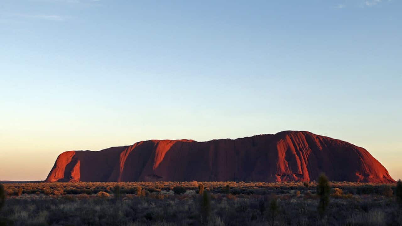 The sun rises over Uluru, Australia