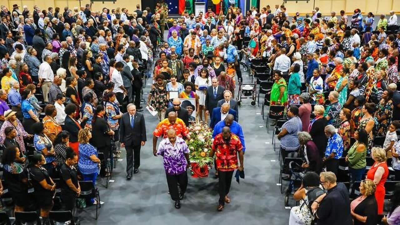 The funeral procession departs Townsville Stadium after the funeral service Bonita Mabo.