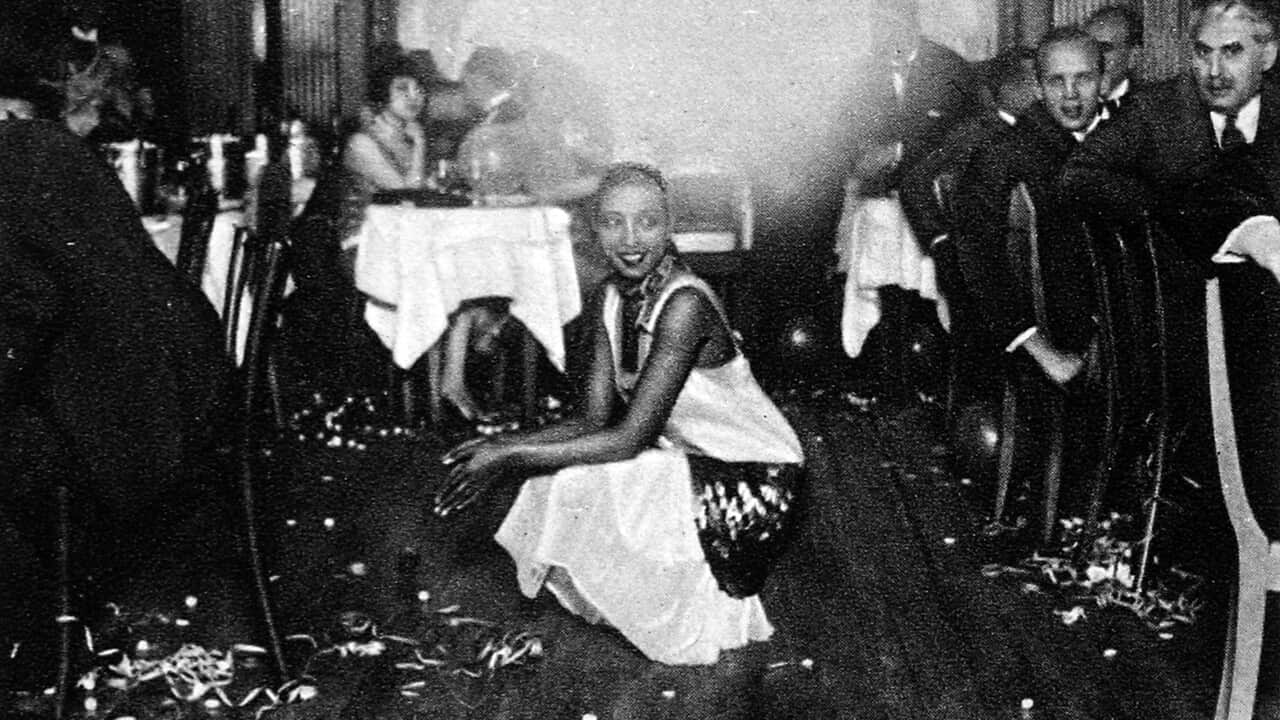 Josephine Baker at her bar in Paris,