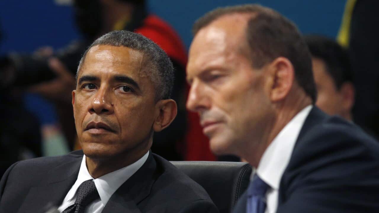 President Barack Obama listens as Australian Prime Minister Tony Abbott at the G20 Summit in Brisbane.