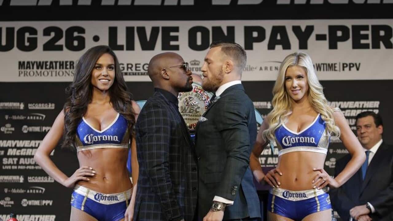 Floyd Mayweather Jr., center left, and Conor McGregor