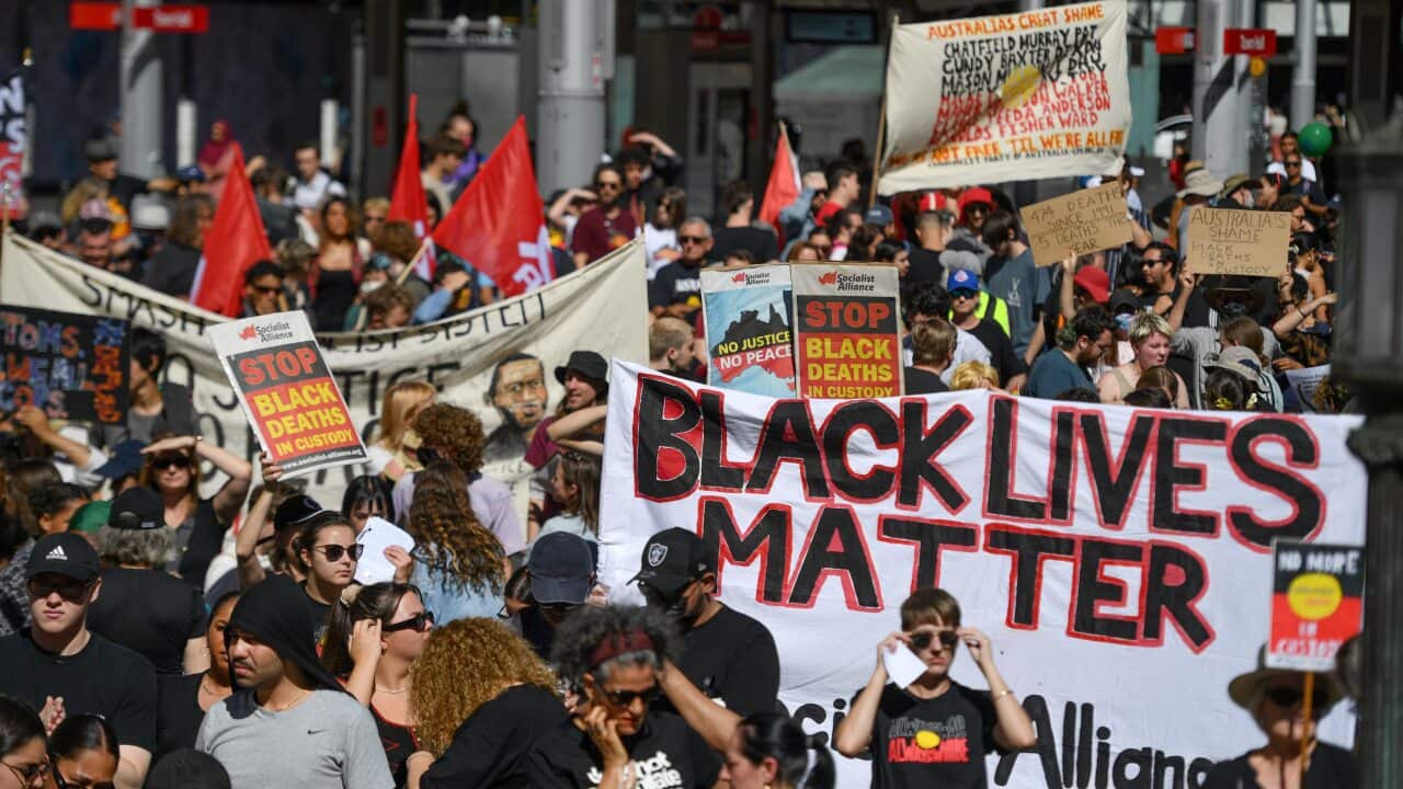 Protesters at a Black Deaths in Custody Rally at Town Hall in Sydney.