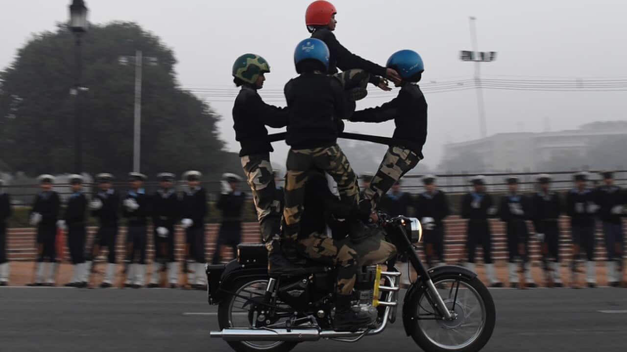 Indian Border Security Force women bikers squad members rehearse early in the morning for the forthcoming Republic Day parade