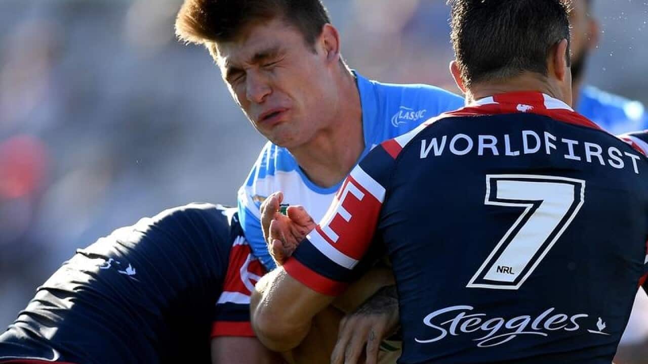 Jai Arrow of the Titans is tackled.