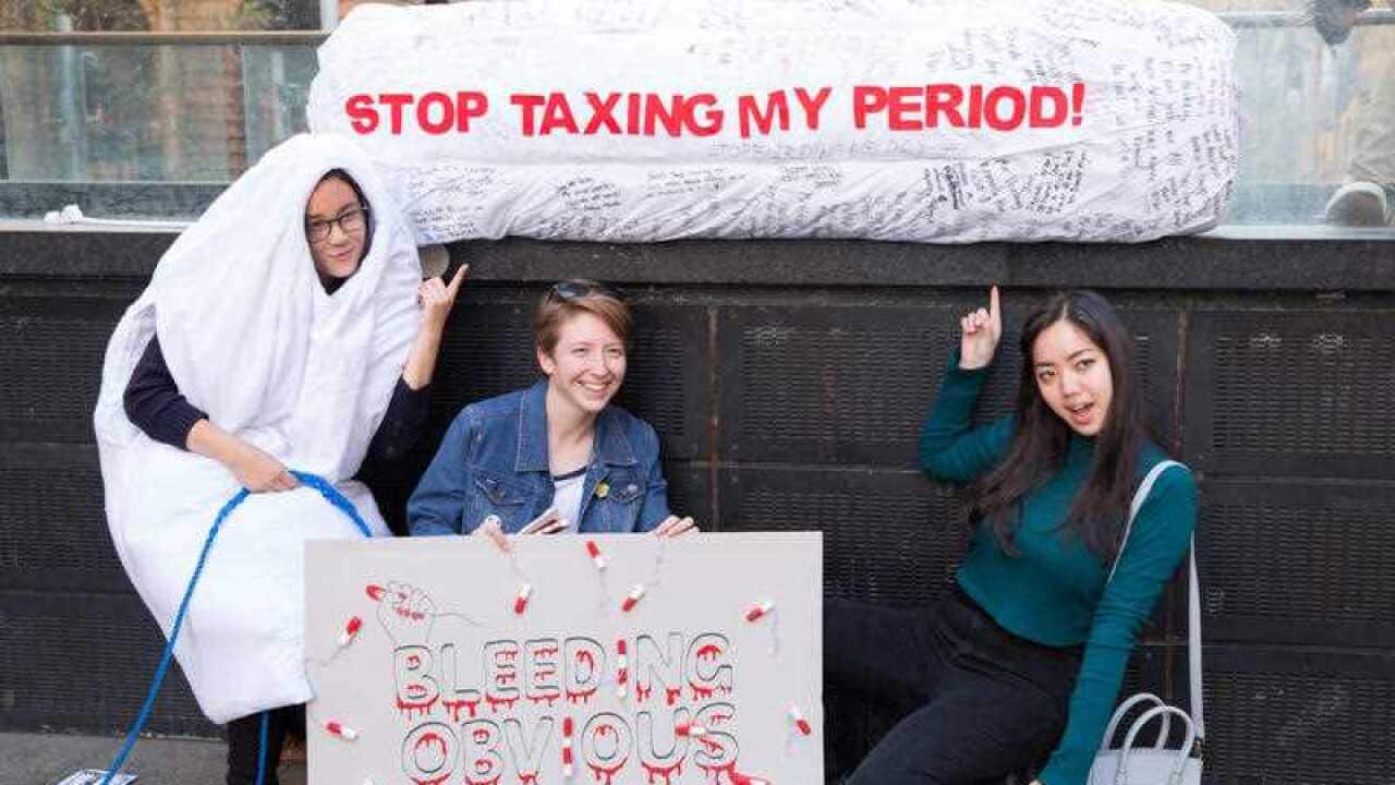Stop Taxing My Period demonstrators based with a giant tampon at a rally in Martin Place, Sydney on August 14, 2015
