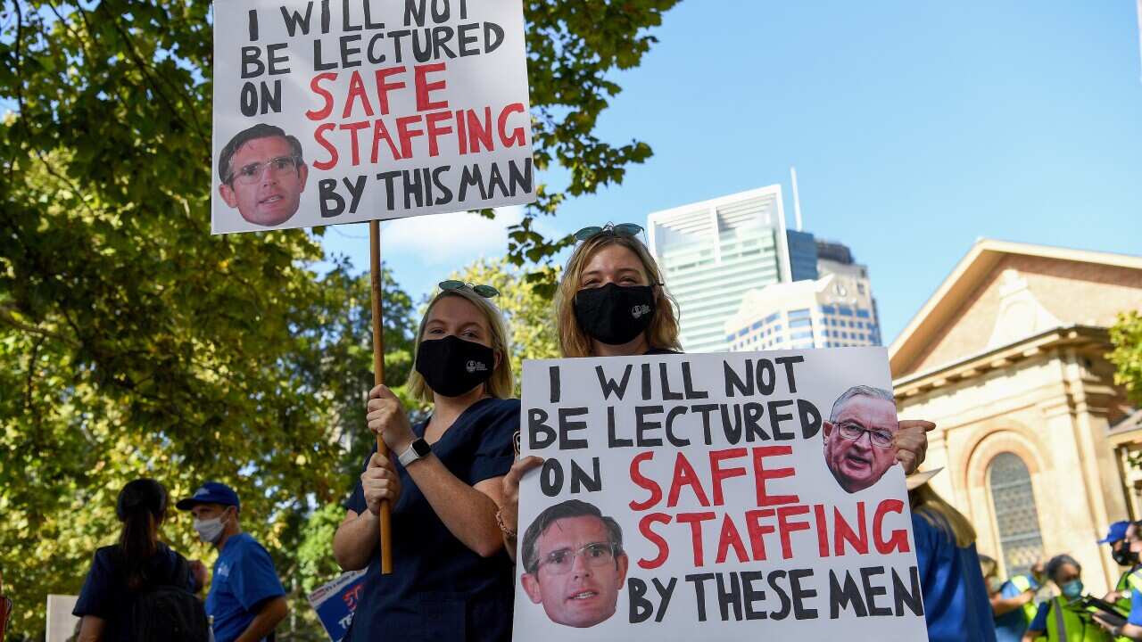 Nurses hold placards during a nurses’ strike in Queen’s Square in Sydney.