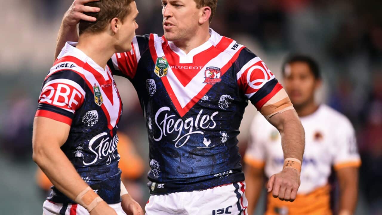 Dale Copley (R) of the Roosters is congratulated by Mitchell Aubusson