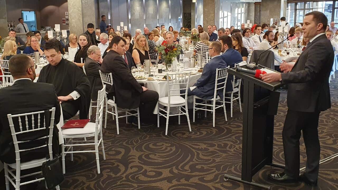 Federal minister for immigration Alex Hawke speaks during the Serbian Statehood Banquet in Sydney