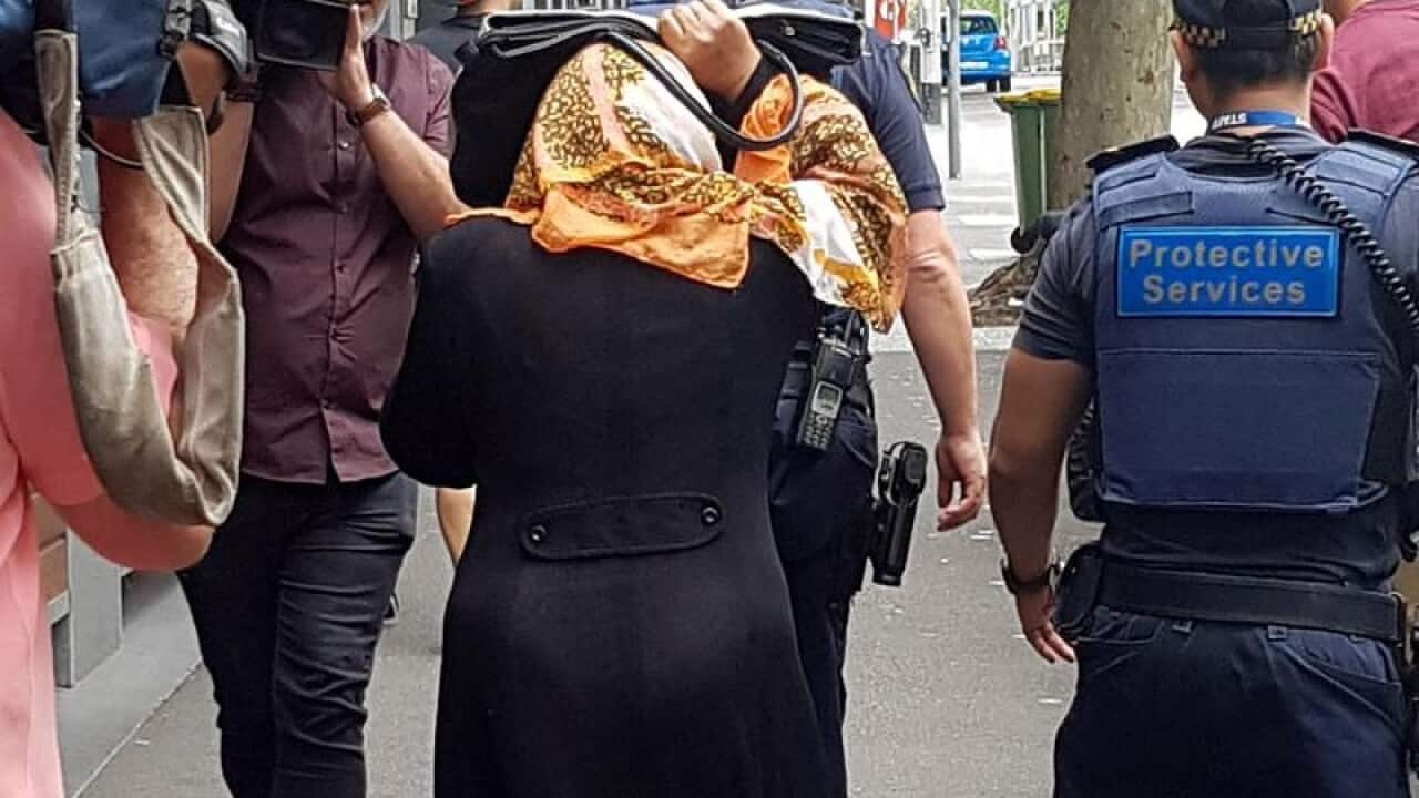 The mother of Saeed Noori is seen leaving Melbourne Magistrates Court.