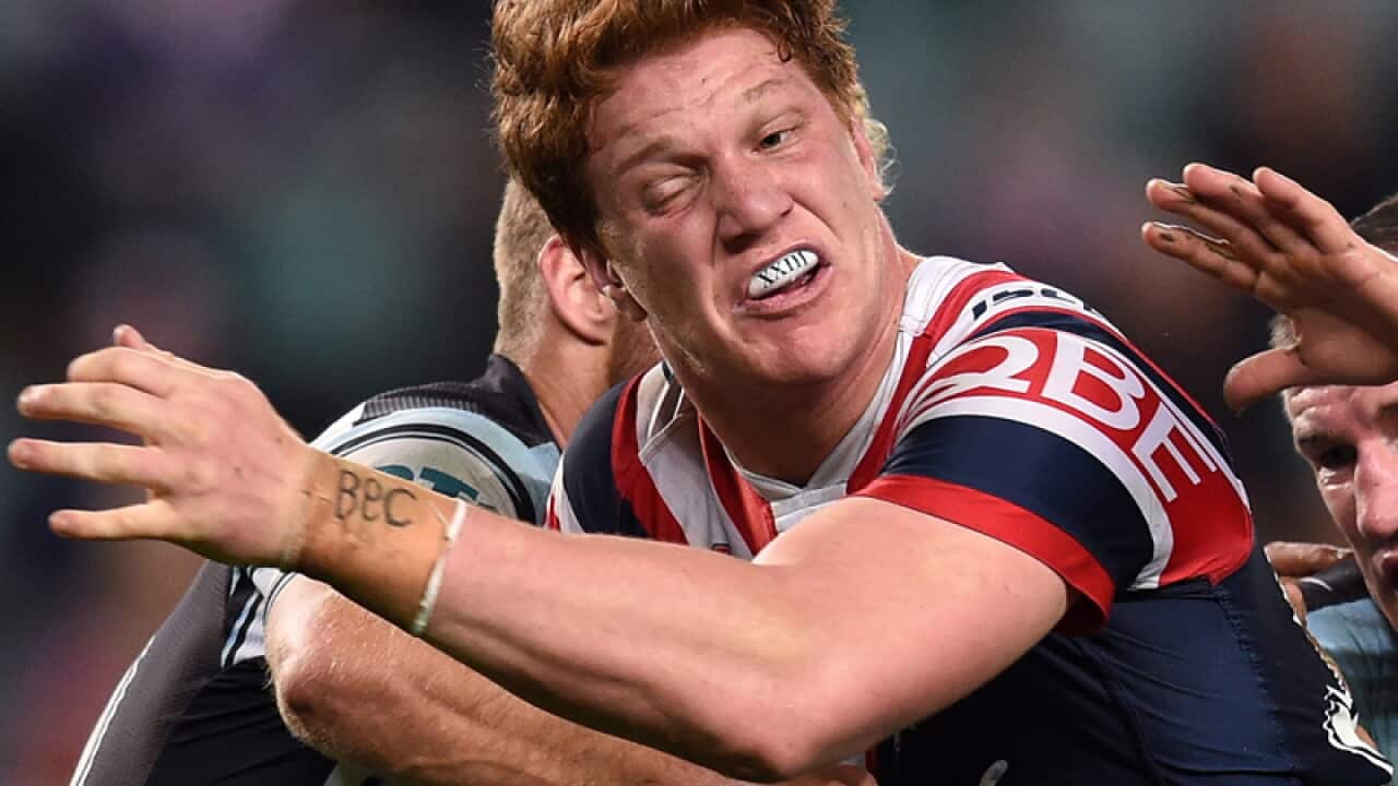Dylan Napa (centre) of the Roosters