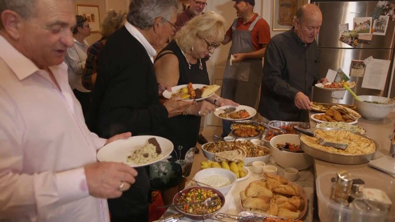 Guests tuck in to the Baghdad Soul Food buffet at Lea Bouganim's dinner party.