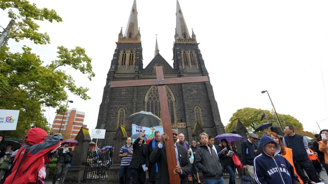 Christians participate in an Ecumenical Way of the Cross procession at St Patrick's Cathedral Mebourne aap.jpg