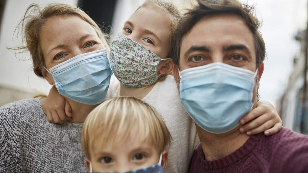 Real Family Taking a Selfie Together While Wearing Protective Face Masks