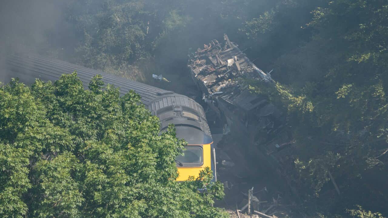 Derailed carriages are seen at the scene of a train crash near Stonehaven in northeast Scotland.