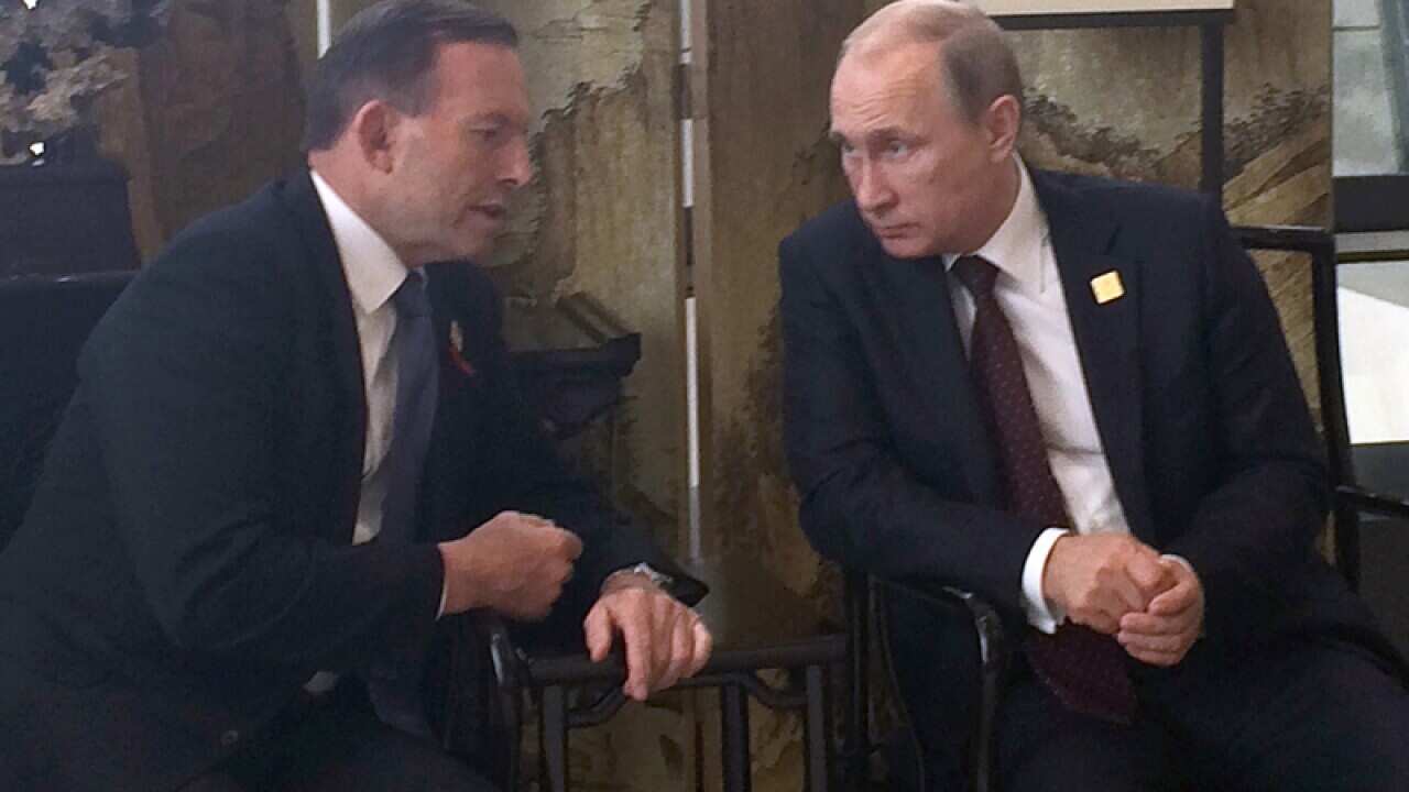 Prime Minister Tony Abbott (L) and Russian President Vladimir Putin