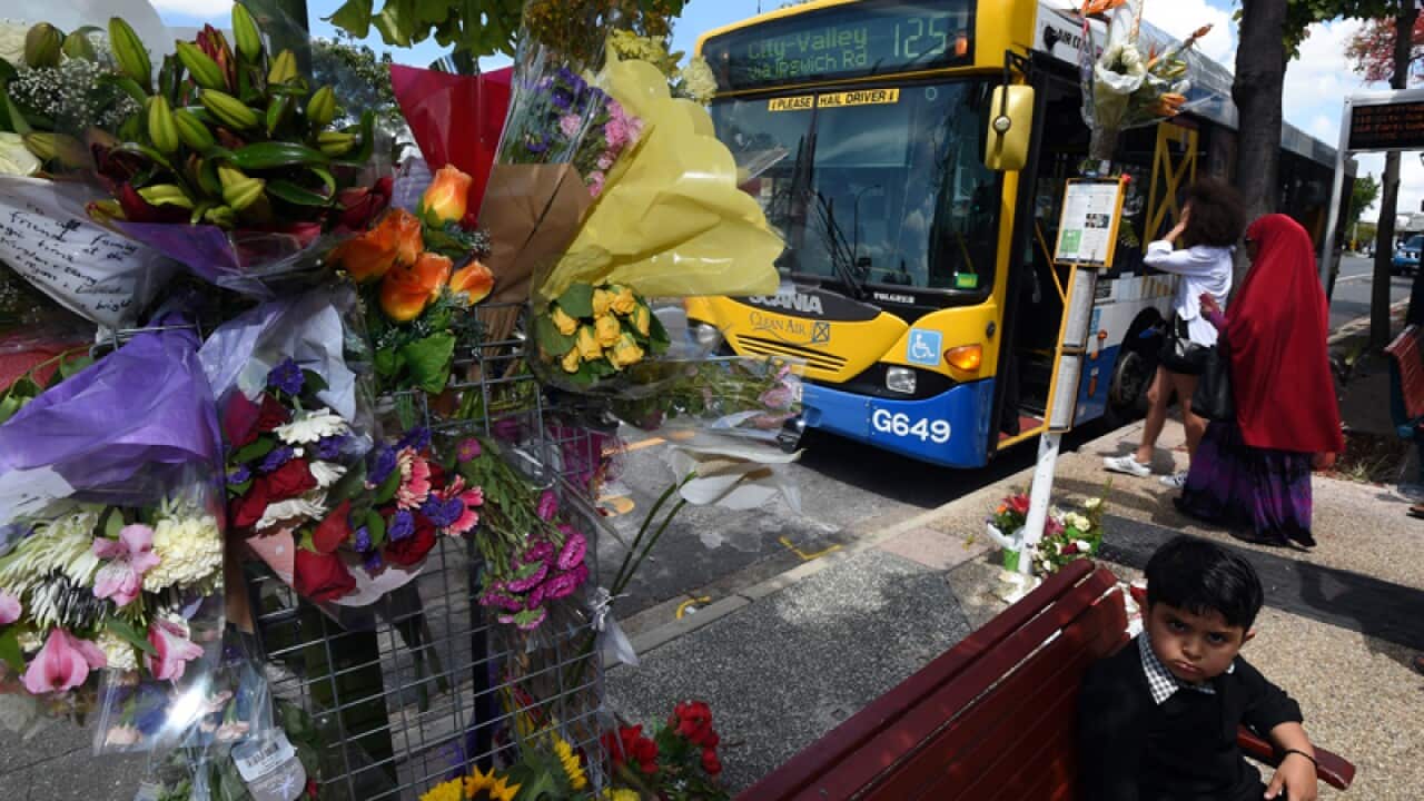 A floral tribute is seen at a bus stop in Morooka