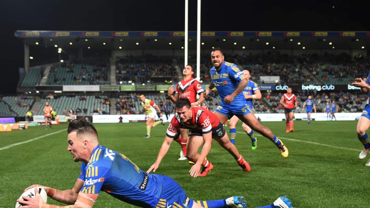 Clinton Gutherson of the Eels scores against the Roosters
