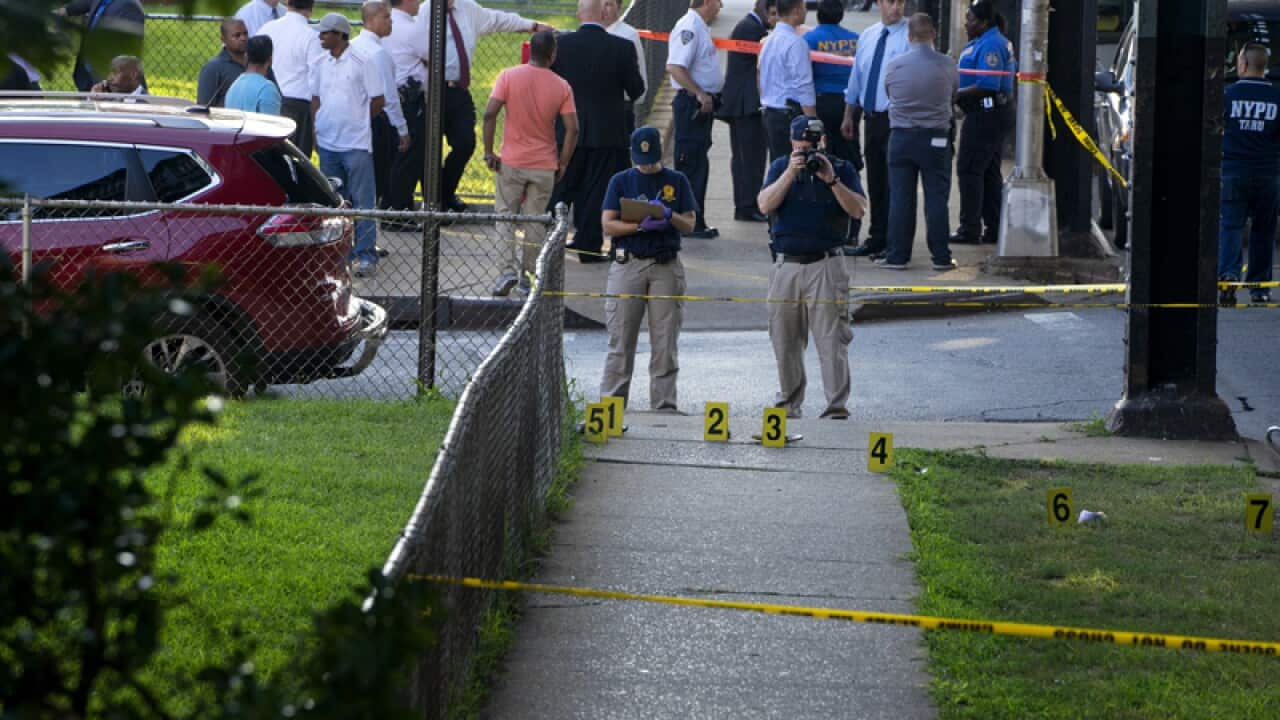 New York police investigators at the scene of a shooting in Queens