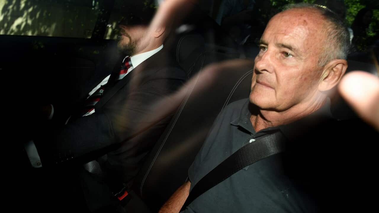 Chris Dawson is escorted by NSW Police detectives as he arrives at Sydney Police Centre at Surry Hills, in Sydney, Thursday, December 6, 2018. (AAP Image/Dan Himbrechts) NO ARCHIVING