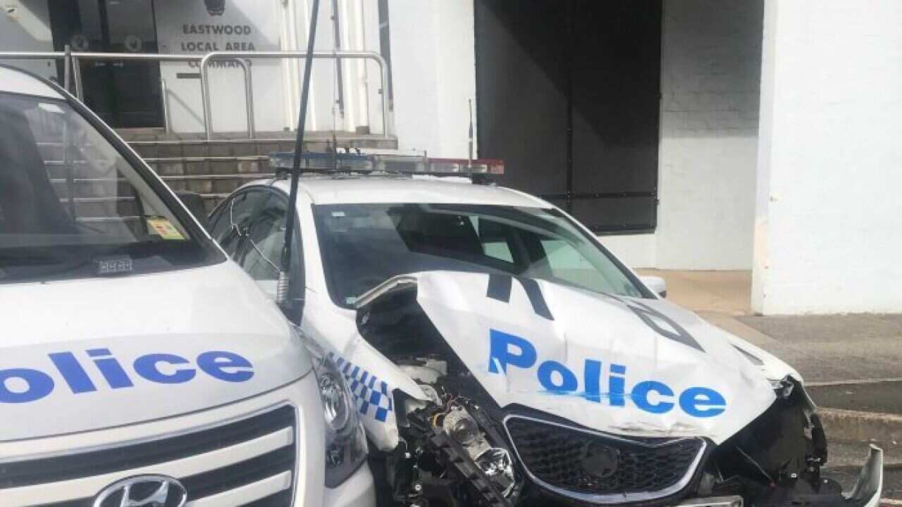 Parked police patrol vehicles was smashed by the van.
