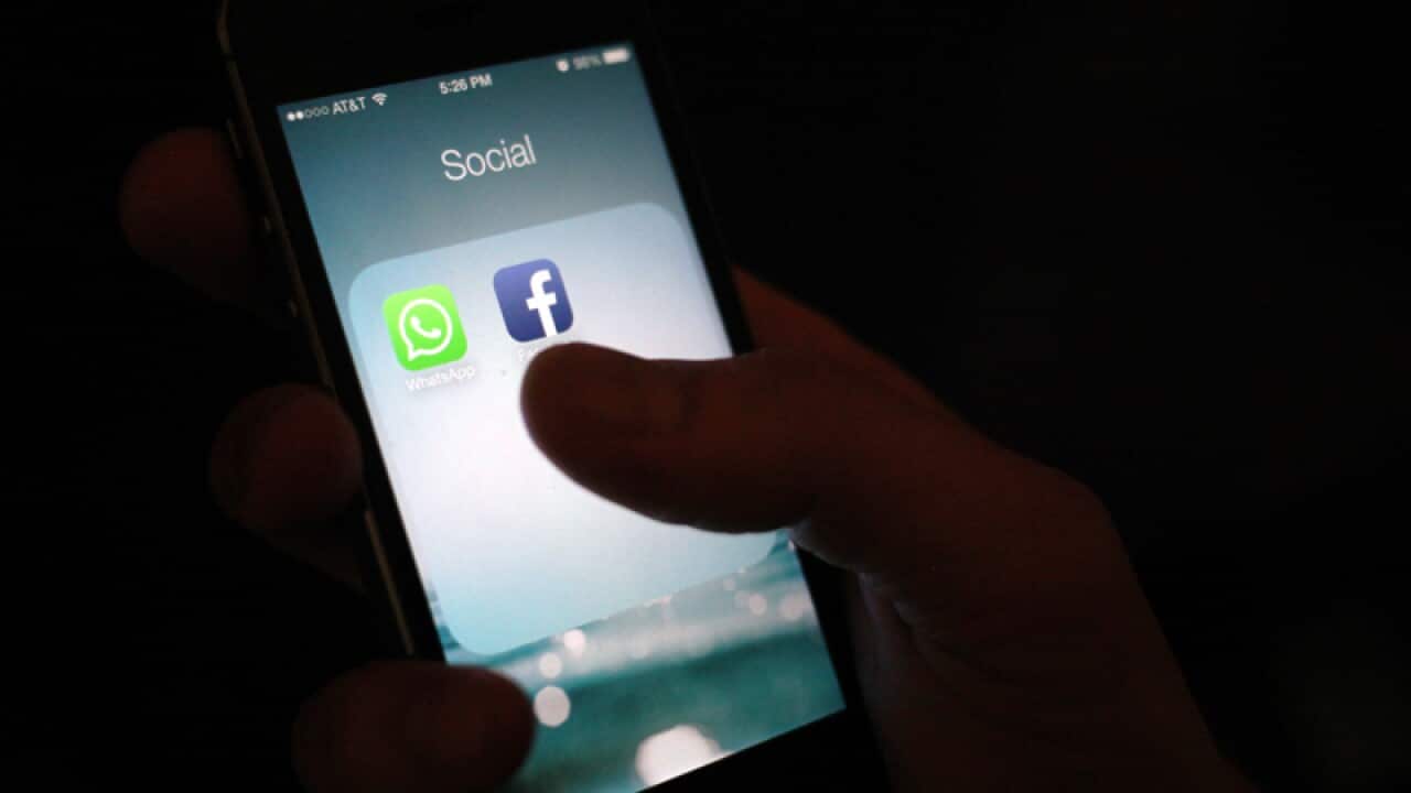 The WhatsApp and Facebook app icons on an iPhone in New York