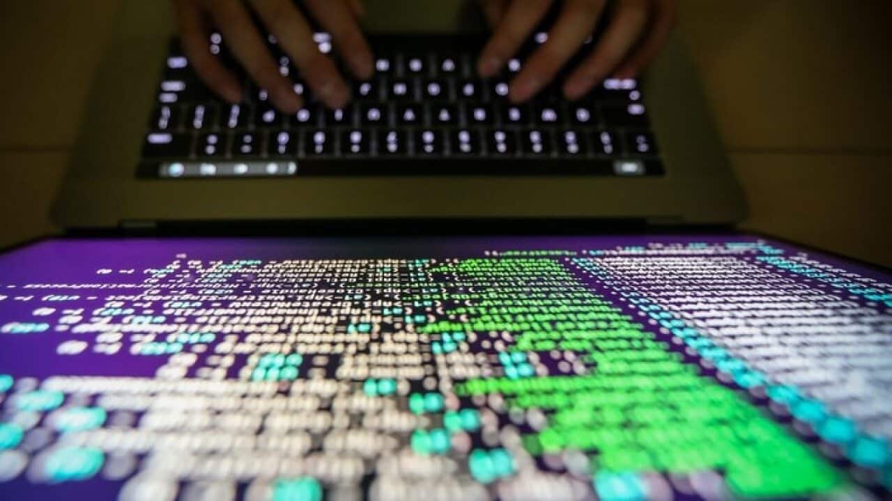 A programmer shows a sample of decrypting source code in Taipei, Taiwan