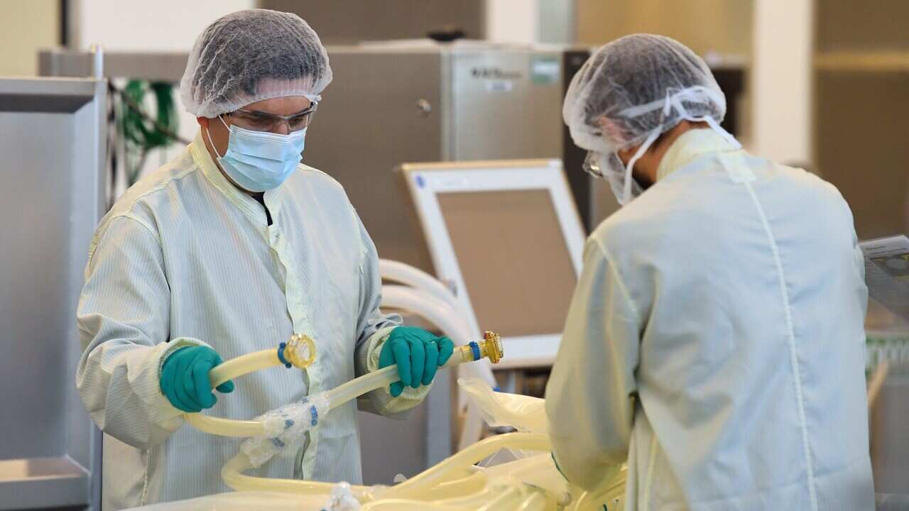 Scientists are seen at work inside of the CSL Biotech facility in Melbourne.
