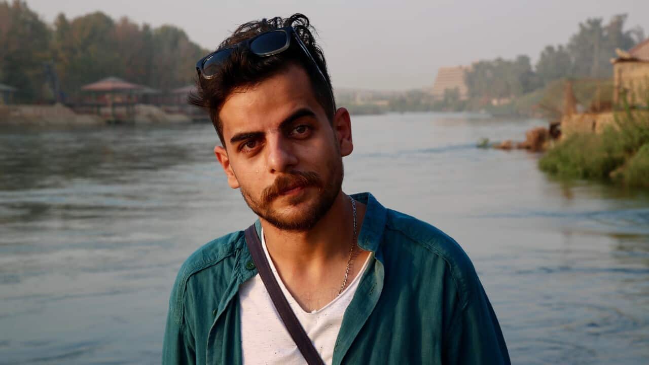 Khalid Waleed, a musician and barber from Mosul.